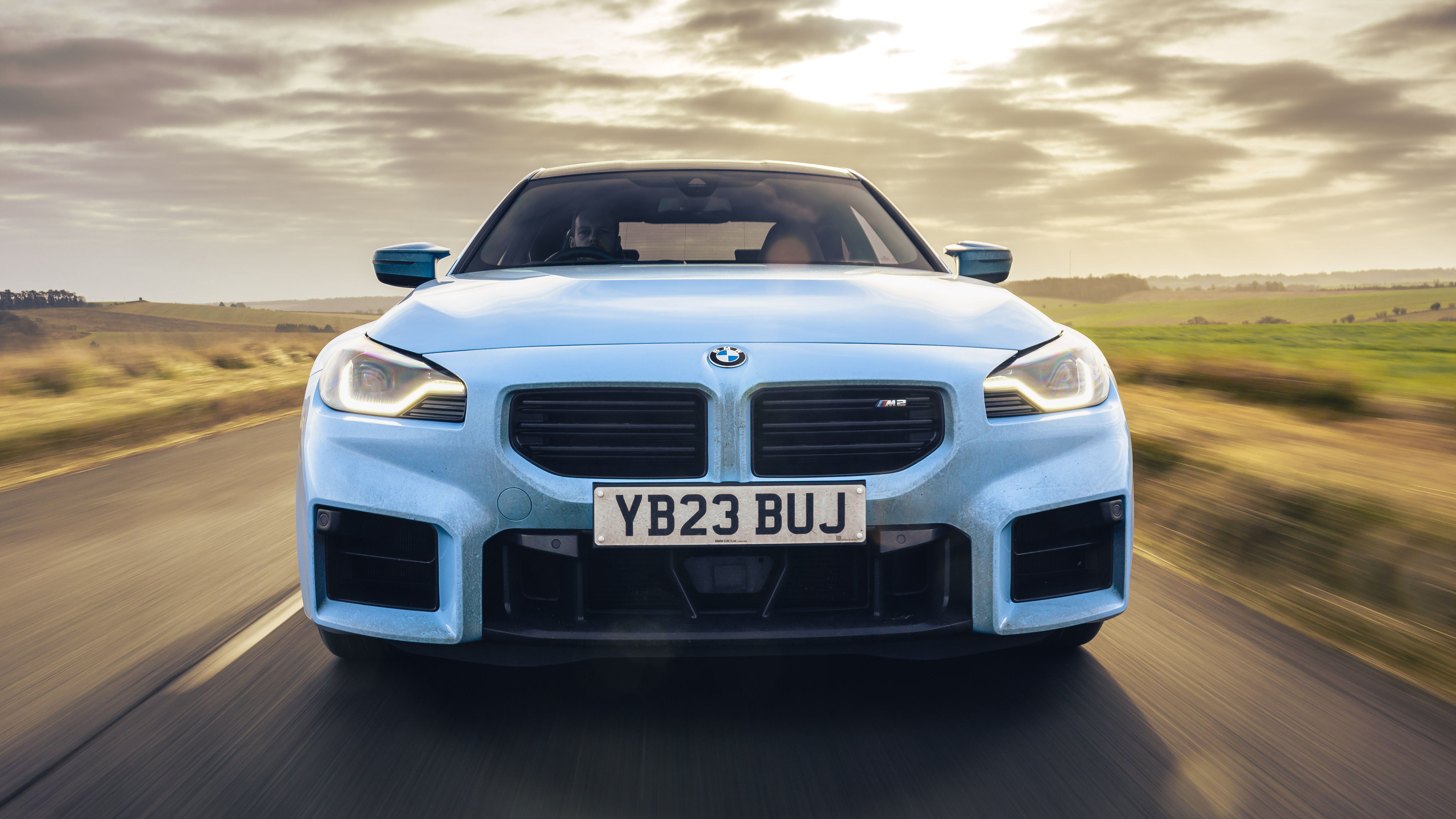 Close-up of the BMW M2's rear end, highlighting the muscular haunches and aggressive diffuser